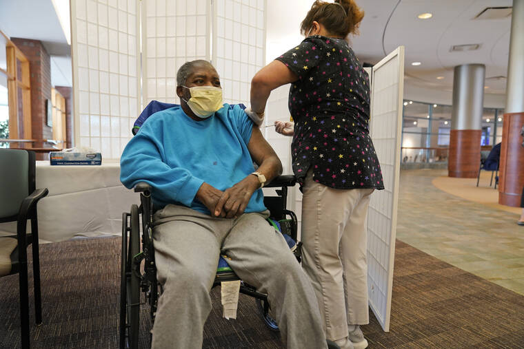 ASSOCIATED PRESS
                                Edward Williams, 62, a resident at the Hebrew Home at Riverdale, received a COVID-19 booster shot in New York, Sept. 27. COVID-19 infections are soaring again at U.S. nursing homes because of the omicron wave, and deaths are climbing too.