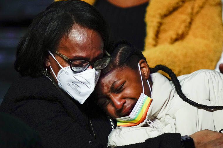 ASSOCIATED PRESS
                                Mourners embraced during funeral services for the victims of a deadly row house fire, at Temple University in Philadelphia, today. Officials said it’s the city’s deadliest single fire in at least a century.