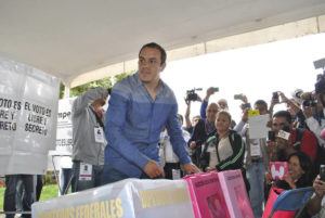 ASSOCIATED PRESS / JUNE 2015
                                FILE - Mexican soccer star Cuauhtemoc Blanco casts his vote during mid-term elections in Cuernavaca, Mexico. Blanco, the governor of Mexico’s Morelos state, denied on Tuesday, Jan. 4, any links to drug traffickers after a 3-year-old photo surfaced showing him posing with three men identified as local drug gang leaders.