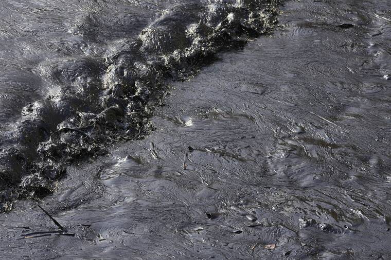ASSOCIATED PRESS
                                Oil from a spill covers the shore at Cavero beach in Ventanilla, Callao, Peru. Unusually high waves that authorities attribute to the eruption of the undersea volcano in Tonga caused the spill on the Peruvian Pacific coast as a ship was loading oil into La Pampilla refinery on Sunday.