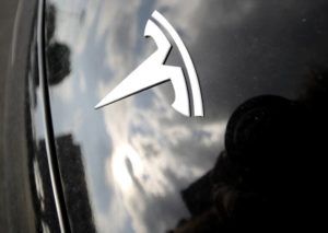ASSOCIATED PRESS
                                Clouds were reflected above the company logo, in July 2018, on the hood of a Tesla vehicle outside a showroom in Littleton, Colo. California prosecutors have filed two counts of vehicular manslaughter against the driver of a Tesla on Autopilot that ran a red light, slammed into another car and killed two people in 2019.