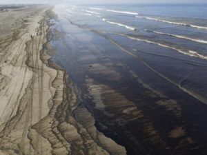 ASSOCIATED PRESS
                                Oil pollutes Cavero beach in Ventanilla, Callao, Peru.