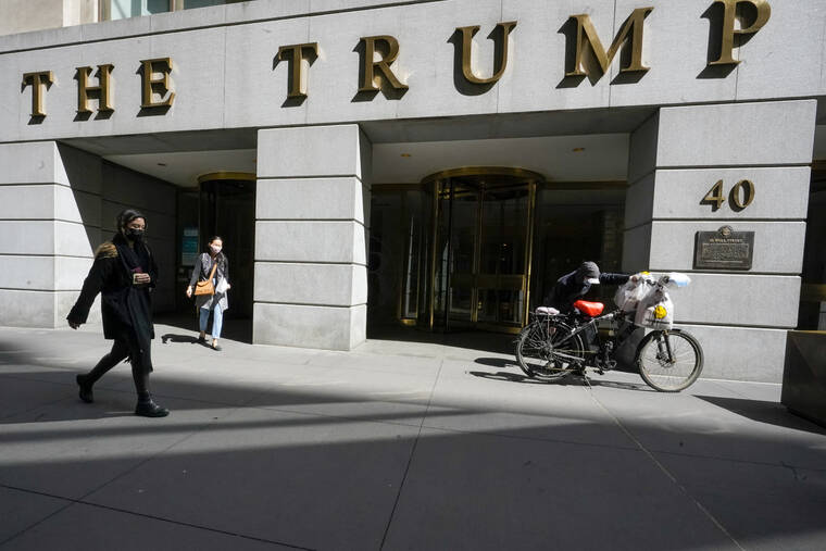 ASSOCIATED PRESS
                                Pedestrians and a food delivery man were seen outside the Trump building at 40 Wall Street in New York’s Financial District, in March 2021. After investigating former President Donald Trump for several years, New York Attorney General Letitia James used a court filing Tuesday to outline much of the evidence her investigators have gathered so far.