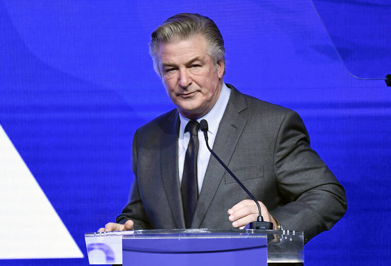 EVAN AGOSTINI/INVISION/AP / DECEMBER 2021
                                Alec Baldwin performs emcee duties at the Robert F. Kennedy Human Rights Ripple of Hope Award Gala at New York Hilton Midtown on in New York.