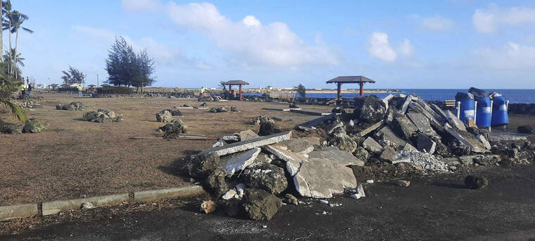 MARIAN KUPU/BROADCOM BROADCASTING VIA ASSOCIATED PRESS
                                This photo provided by Broadcom Broadcasting shows a damaged area in Nuku’alofa, Tonga, Thursday, following Saturday’s volcanic eruption near the Pacific archipelago. The first flight carrying fresh water and other aid to Tonga was finally able to leave Thursday after the Pacific nation’s main airport runway was cleared of ash left by the eruption.