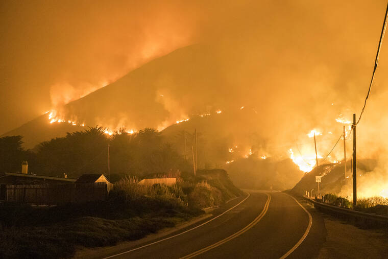 NIC COURY / AP
                                The Colorado Fire burns along Highway 1 near Big Sur, Calif., Saturday, Jan. 22, 2022.