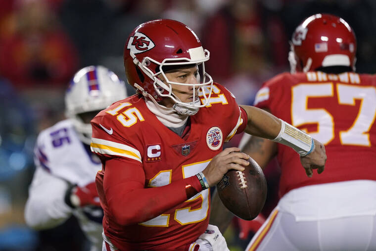 ASSOCIATED PRESS
                                Kansas City Chiefs quarterback Patrick Mahomes (15) looks to pass during the first half of an NFL divisional round playoff football game against the Buffalo Bills today in Kansas City, Mo.