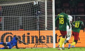ASSOCIATED PRESS
                                Comoros’ goalkeeper Chaker Alhadhur, left, fails to stop a goal shot from Cameroon’s Vincent Aboubakar, far right, during the African Cup of Nations 2022 round of 16 soccer match between Cameroon and Comoros at the Olembe stadium in Yaounde, Cameroon.