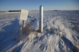 JOHN WOODS/THE CANADIAN PRESS VIA AP / JAN. 20
                                A border marker, between the United States and Canada is shown just outside of Emerson, Manitoba. A Florida man was charged Thursday with human smuggling after the bodies of four people, including a baby and a teen, were found in Canada near the U.S. border, in what authorities believe was a failed crossing attempt during a freezing blizzard. The bodies were found Wednesday in the province of Manitoba just meters (yards) from the U.S. border near the community of Emerson.