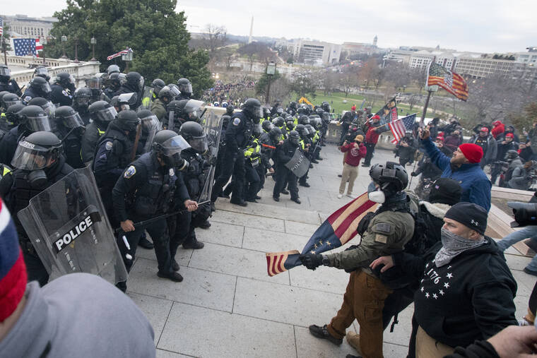 ASSOCIATED PRESS / JAN. 6, 2021
                                Rioters face off with police at the U.S. Capitol in Washington. A pro-Trump social media influencer who posted video of himself at the U.S. Capitol during last year’s riot has been sentenced to three months of home detention.
