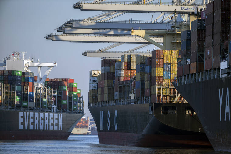 ASSOCIATED PRESS
                                Container ship Ever Far, left, sailed downriver past the Georgia Ports Authority’s Port of Savannah, Sept. 29, in Savannah, Ga. Inflation has spiked during the recovery from the pandemic recession as Americans have ramped up spending on such items as cars, furniture and appliances. Those increased purchases have clogged ports and warehouses and exacerbated supply shortages of semiconductors and other parts.