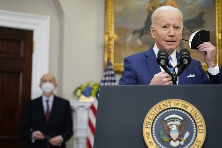 ASSOCIATED PRESS
                                President Joe Biden removed his face mask as he prepared to deliver remarks on the retirement of Supreme Court Associate Justice Stephen Breyer, left, in the Roosevelt Room of the White House in Washington, today.