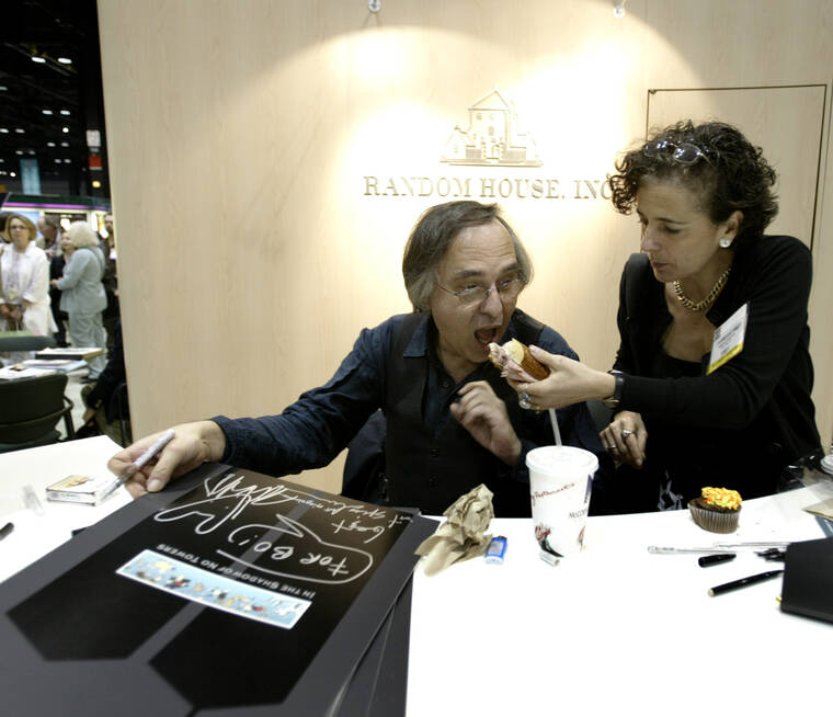 ASSOCIATED PRESS
                                Artist and author Art Spiegelman got some help with his lunch from Francoise Mouly, of Random House, Inc., during a signing of Spiegelman’s new book “In the Shadow of No Towers” at the Book Expo America convention, in June 2004, in Chicago. A Tennessee school district has voted to ban a Pulitzer Prize-winning graphic novel about the Holocaust due to “inappropriate language” and an illustration of a nude woman.