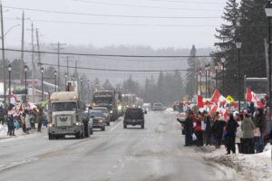 THE CANADIAN PRESS / AP
                                Protesters and supporters against a COVID-19 vaccine mandate for cross-border truckers cheer as a parade of trucks and vehicles pass through Kakabeka Falls outside of Thunder Bay, Ontario, on Wednesday, Jan. 26.