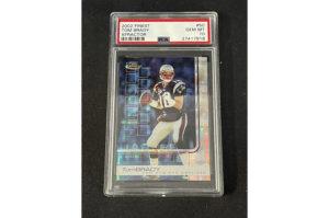 ASSOCIATED PRESS
                                In this photo provided by Saco River Auction LLC, a 2002 Topps Finest X-Fractor card showing football quarterback Tom Brady rests inside a transparent case, Wednesday, Jan. 19, 2022, in Gorham, Maine. Troy Thibodeau from Saco River Auction estimates the card will fetch six figures when it’s auctioned on Jan. 31.
