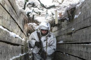 ALEXEI ALEXANDROV / AP
                                An armed serviceman walks along a trench on the territory controlled by pro-Russian militants on the frontline with Ukrainian government forces near Spartak village in Yasynuvata district of Donetsk region, eastern Ukraine.