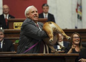 CHRIS DORST/CHARLESTON GAZETTE-MAIL VIA ASSOCIATED PRESS
                                West Virginia Gov. Jim Justice held up his dog Babydog’s rear end as a message to people who’ve doubted the state as he comes to the end of his State of the State speech in the House chambers, Thursday, in Charleston, W.Va.