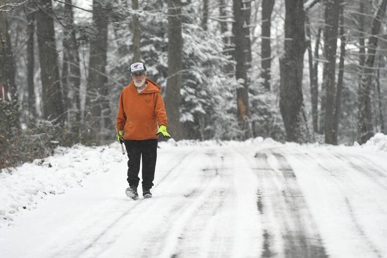 JACQUELINE DORMER/REPUBLICAN-HERALD VIA ASSOCIATED PRESS
                                Kenneth Wolfe, of Pine Grove, walked along Clubhouse Road by Sweet Arrow Lake County Park in Pine Grove, Pa., today.