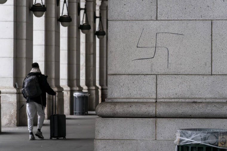 J. SCOTT APPLEWHITE / AP
                                A hand-drawn swastika is seen on the front of Union Station near the Capitol in Washington.