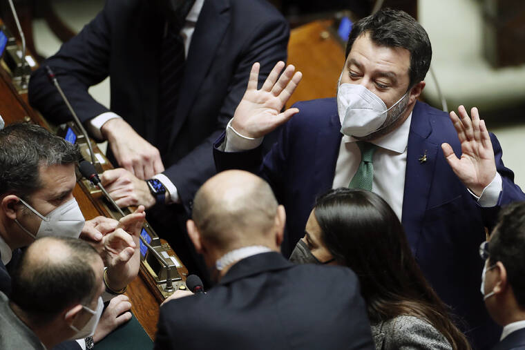 POOL PHOTO / AP
                                Lawmaker Matteo Salvini, right, speaks to colleagues in the Italian parliament in Rome, Saturday, Jan. 29, during the seventh round of voting for Italy’s 13th president.