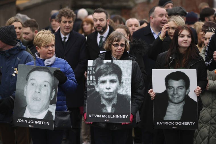 ASSOCIATED PRESS
                                Relatives of those who were killed in the Bloody Sunday shootings with photographs bearing their names as they take part in a march to commemorate the 50th anniversary of the ‘Bloody Sunday’ in Londonderry, today. In 1972 British soldiers shot 28 unarmed civilians at a civil rights march, killing 13 on what is known as Bloody Sunday or the Bogside Massacre.
