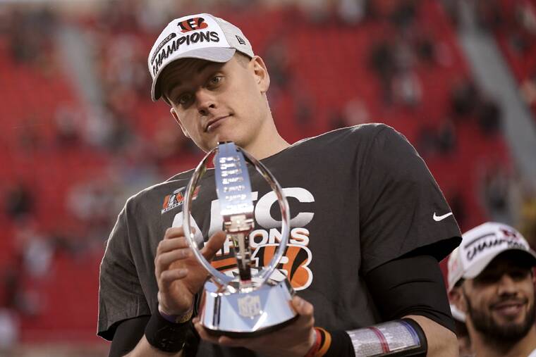 ASSOCIATED PRESS
                                Cincinnati Bengals quarterback Joe Burrow (9) holds the Lamar Hunt trophy after today’s AFC championship NFL football game against the Kansas City Chiefs in Kansas City, Mo. The Bengals won, 27-24, in overtime.