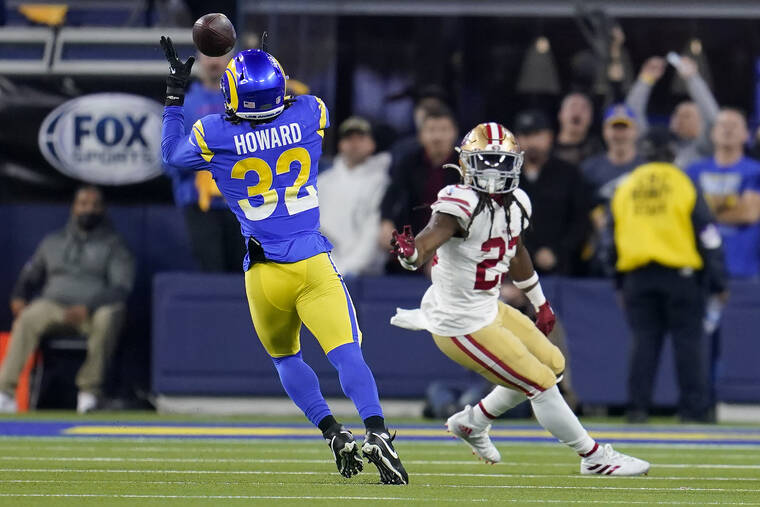 ASSOCIATED PRESS
                                Los Angeles Rams’ Travin Howard (32) intercepts a pass in front of San Francisco 49ers’ JaMycal Hasty during the second half of the NFC Championship NFL football game today in Inglewood, Calif.
