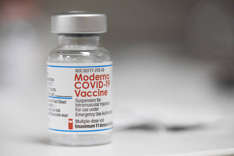 ASSOCIATED PRESS A vial of the Moderna COVID-19 vaccine was displayed on a counter at a pharmacy in Portland, Ore., Dec. 27. U.S. regulators have granted full approval to Modernas COVID-19 vaccine after reviewing additional data on its safety and effectiveness.