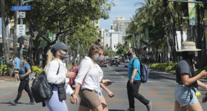 JAMM AQUINO/JAQUINO@STARADVERTISER.COM
                                Pedestrians walk on Kalakaua Avenue.
