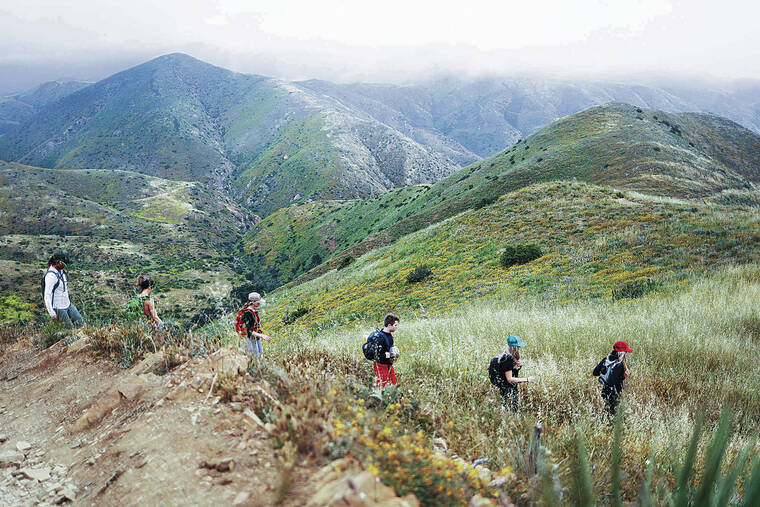 THE RANCH MALIBU VIA NEW YORK TIMES
                                Hikers trek at The Ranch Malibu in Malibu, Calif.