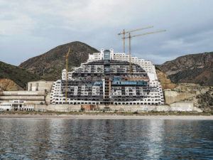 NEW YORK TIMES 
                                The hulk of the never-finished Hotel El Algarrobico near Almeria, Spain. Construction was halted in 2006 after activists sued, saying it should not have been built in a protected area. The court battles have dragged on.