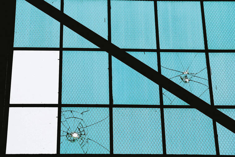 JAMM AQUINO / JAQUINO@STARADVERTISER.COM
                                Bullet holes from the attack on Pearl Harbor on Dec. 7, 1941, are seen in the hangar glass at the Pearl Harbor Aviation Museum.