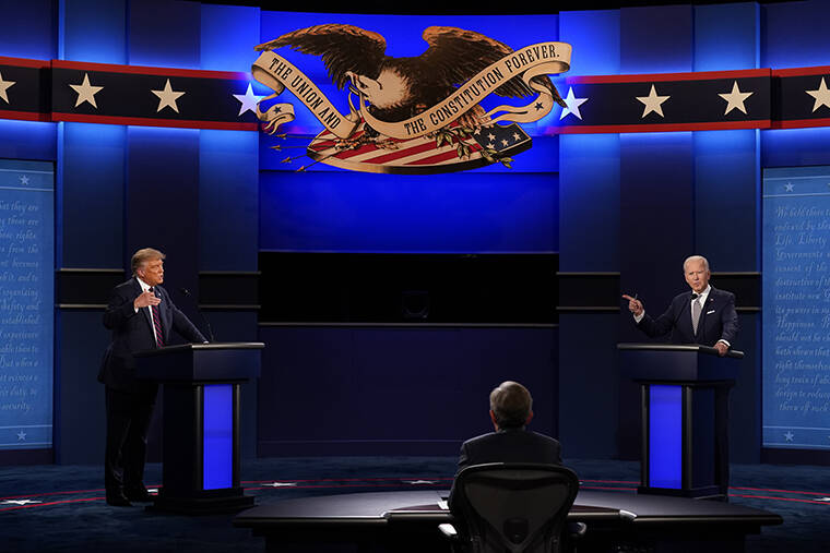 ASSOCIATED PRESS / 2020
                                President Donald Trump, left, and Democratic presidential candidate former Vice President Joe Biden, right, with moderator Chris Wallace, center, of Fox News during the first presidential debate on Sept. 29, 2020, at Case Western University and Cleveland Clinic, in Cleveland, Ohio.