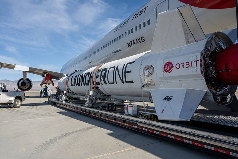 BUSINESS WIRE / AP
                                LauncherOne Rocket is Mated with Cosmic Girl Aircraft for ‘Above the Clouds’ Mission, Nov. 8, 2021.