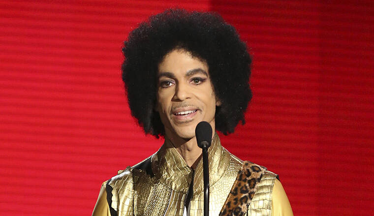 INVISION / AP
                                Prince presents the award for favorite album - soul/R&B at the American Music Awards in Los Angeles in 2015.