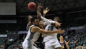 STAR-ADVERTISER / JAN. 15
                                Hawaii forward Zoar Nedd (20), right, and forward Jerome Desrosiers (22) fight for possession with UC San Diego forward Francis Nwaokorie (35), back left, and guard Kaden Rasheed (23) during the second half of an NCAA basketball game.