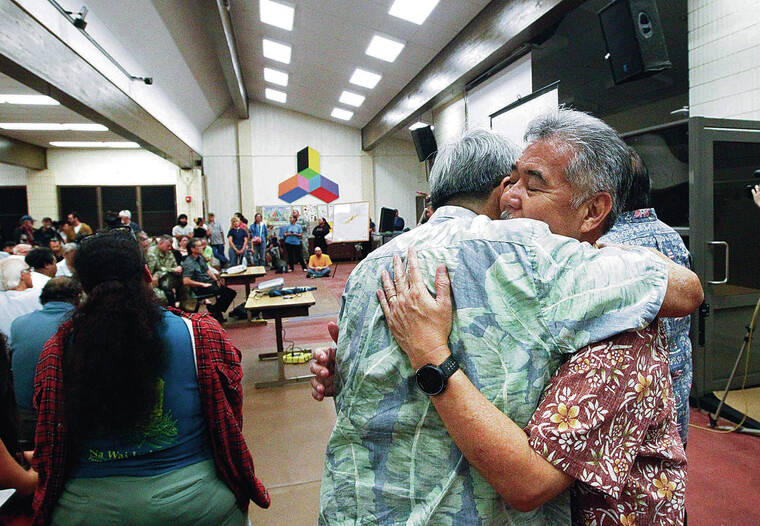 STAR-ADVERTISER
                                Ige, right, embraced Hawaii County Mayor Harry Kim during a May 2018 community meeting in Pahoa about Kilauea’s destructive eruption.