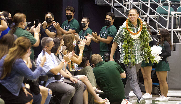 CINDY ELLEN RUSSELL / CRUSSELL@STARADVERTISER.COM
                                New University of Hawaii football head coach Timmy Chang walks into the SimpliFi Arena at the Stan Sheriff Center on Friday.