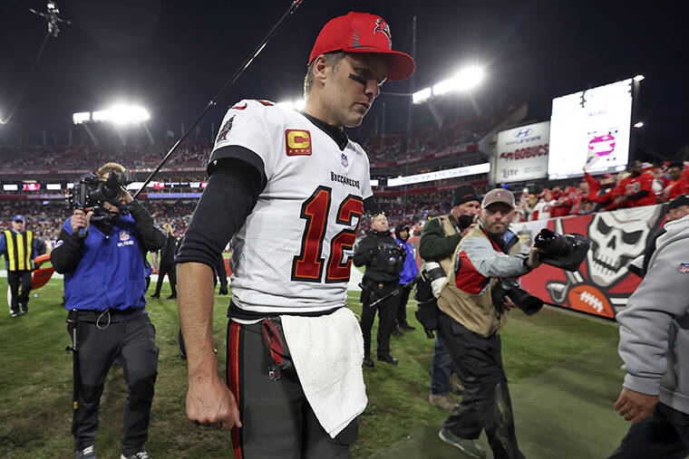 ASSOCIATED PRESS / JAN. 23
                                Tampa Bay Buccaneers quarterback Tom Brady (12) reacts as he leaves the field after the team lost to the Los Angeles Rams during an NFL divisional round playoff football game.