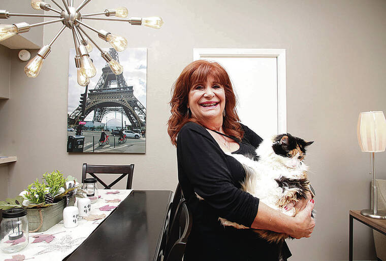 TAMPA BAY TIMES / TNS / NOV. 16
                                Cynthia St. Lawrence, 72, has no children and is seeking the opportunity to live in a communal living community. Above, St. Lawrence and her cat, Callie, currently reside in a 55-plus community in Clearwater, Fla.