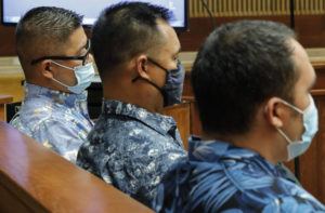 JAMM AQUINO/HONOLULU STAR-ADVERTISER VIA AP, POOL
                                Honolulu police officers Geoffrey Thom, left, Christopher Fredaluces, and Zackary Ah Nee sit in the district courtroom of Judge William Domingo during a preliminary hearing Tuesday, Aug. 17, 2021, in Honolulu, to decide whether the officers should be tried on murder and attempted murder charges for a shooting that killed teenager Iremamber Sykap and injured his brother.