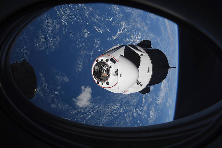 NASA VIA AP / APRIL 2021
                                The SpaceX Crew Dragon capsule approaches the International Space Station for docking.