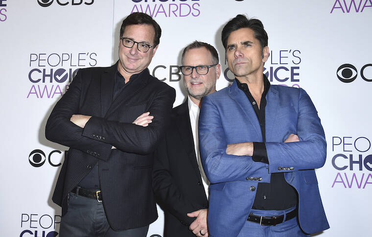 JORDAN STRAUSS/INVISION/AP/ 2017
                                Bob Saget, from left, Dave Coulier, and John Stamos, poses in the press room at the People’s Choice Awards at the Microsoft Theater in Los Angeles.
