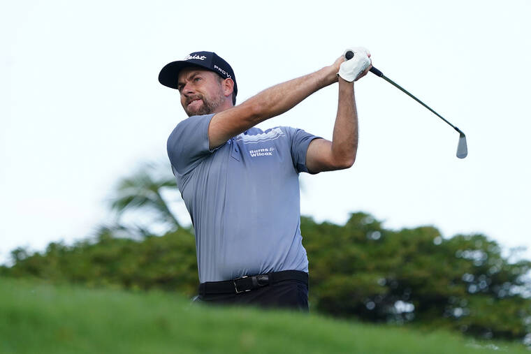 ASSOCIATED PRESS
                                Webb Simpson plays his shot from the 11th tee during the Sony Open golf tournament pro-am event today.