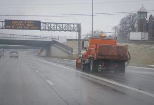 BRYON HOULGRAVE/THE DES MOINES REGISTER VIA AP
                                An Iowa DOT snow plow treats a portion of Interstate 235 in Des Moines before a winter storm.
