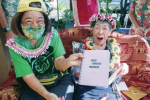 CRAIG T. KOJIMA / CKOJIMA@ STARADVERTISER.COM
                                At a party Saturday, Shanti Mizuno held a book for her mother, Amy H. Mizuno, who turned 100 years old Tuesday. The title is “Don’t Let Them Tame You.”
