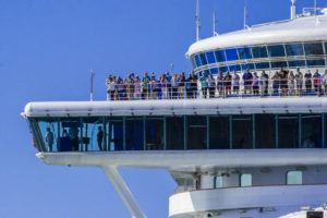 CRAIG T. KOJIMA/CKOJIMA@ STARADVERTISER.COM
                                Passengers atop observation deck on bow of Grand Princess as they entered Honolulu Harbor.