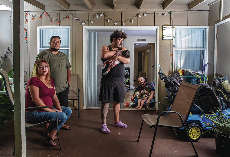 CINDY ELLEN RUSSELL / CRUSSELL@STARADVERTISER.COM
                                The Owens/Bonilla family has been affected by the tainted water that has led to hospitalizations and living in a home that is uninhabitable. Pictured is Mandie Ruiz, left; Taeler Owens; Jayden Bonilla, with his 2-1/2-month-old daughter, Esme; Xavier Bonilla with his dog, Lucky; and 2-year-old Kaleo Hughes.