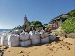STAR-ADVERTISER / PHOTO COURTESY BRIAN VASTAG
                                The state approved emergency sandbags for a stretch of coastline in Kapaa, Kauai. “Burritos” were placed recently on the beach at 950 Niulani Road.