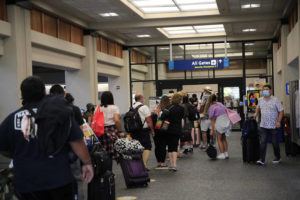 JAMM AQUINO/JAQUINO@STARADVERTISER.COM
                                Travelers wait in line at a TSA security check point at Daniel K. Inouye International Airport.